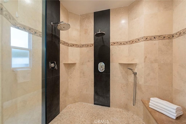 bathroom with a tile shower