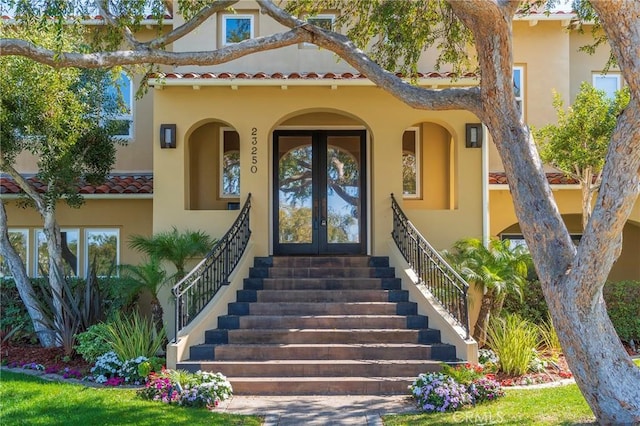 entrance to property featuring french doors