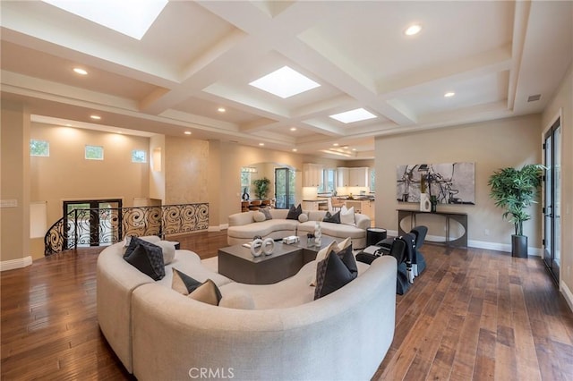 living room with beam ceiling, dark hardwood / wood-style floors, and coffered ceiling