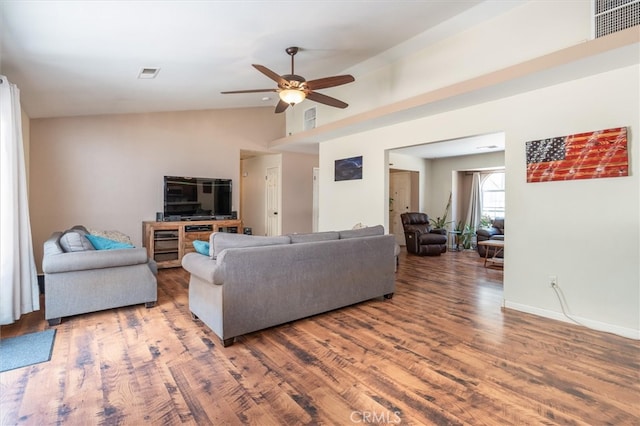 living room with ceiling fan, high vaulted ceiling, and hardwood / wood-style floors