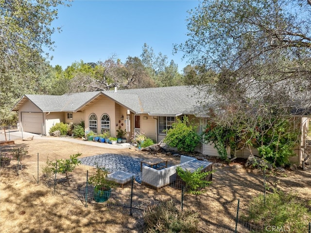 back of property with a garage