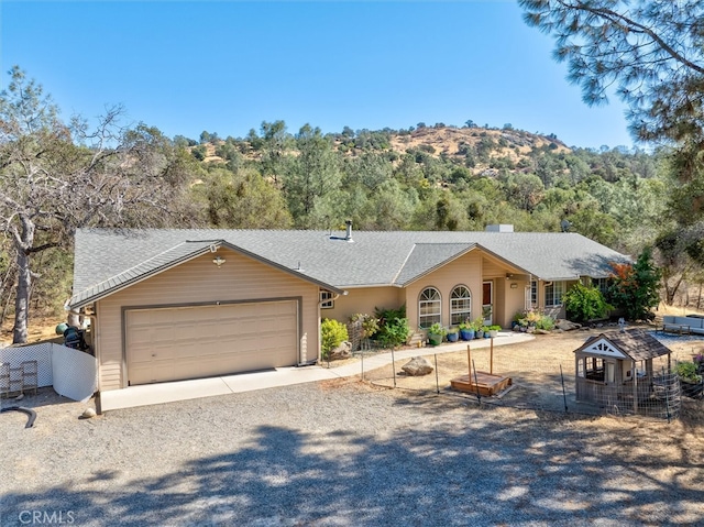 ranch-style home featuring a garage