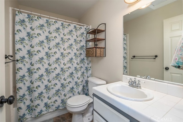 bathroom featuring vanity, curtained shower, toilet, and tile patterned flooring