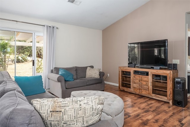 living room with lofted ceiling and dark hardwood / wood-style flooring