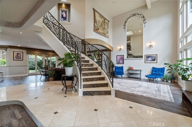 2550 E Jenny Ave, Fresno, CA 93720 - entryway featuring light hardwood / wood-style floors, a towering ceiling, and ornamental molding