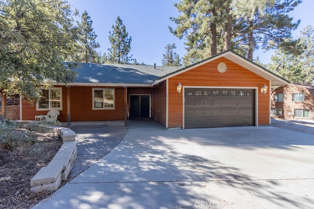 ranch-style home with a garage