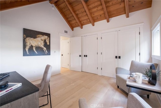 office space with beam ceiling, light hardwood / wood-style floors, high vaulted ceiling, and wood ceiling