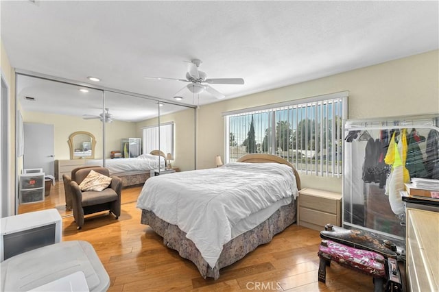 bedroom featuring ceiling fan and light hardwood / wood-style floors