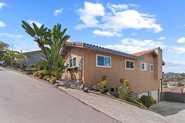 view of side of property featuring a garage