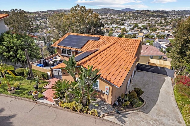 birds eye view of property featuring a mountain view