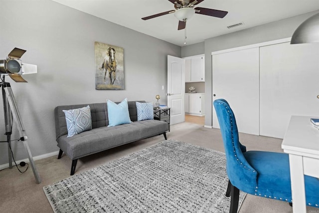 office with ceiling fan and light carpet