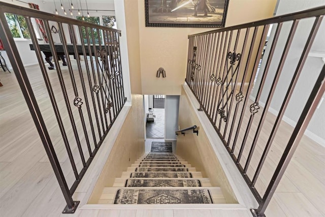 staircase featuring plenty of natural light