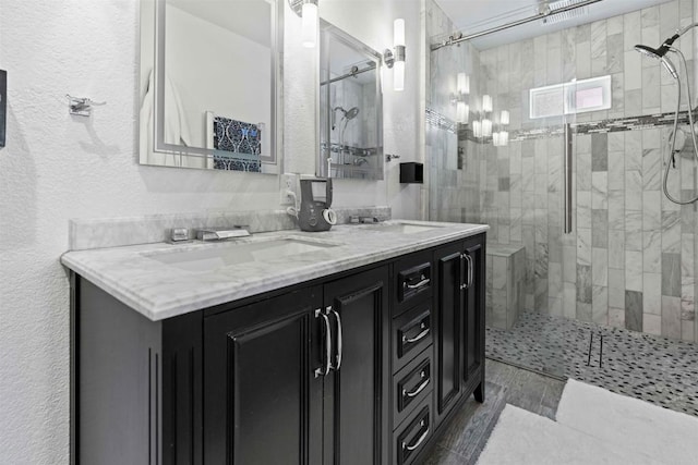 bathroom with vanity and a shower with shower door