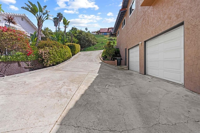 view of side of home with a garage