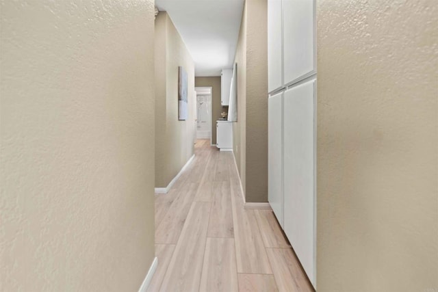 hallway featuring light hardwood / wood-style floors