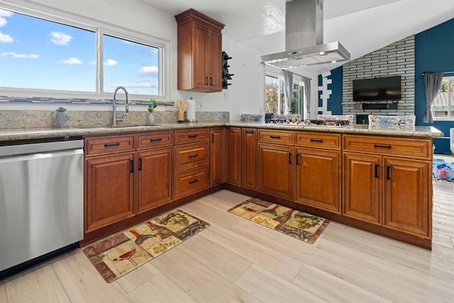 kitchen featuring island exhaust hood, stainless steel appliances, light hardwood / wood-style flooring, and a wealth of natural light