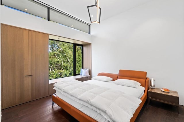 bedroom featuring dark hardwood / wood-style floors