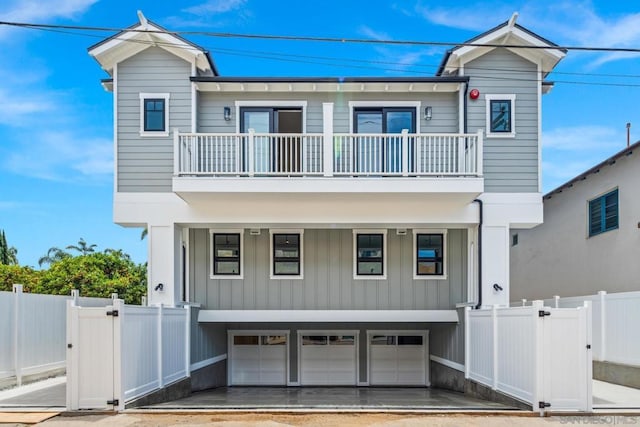 view of front of house featuring a garage and a balcony