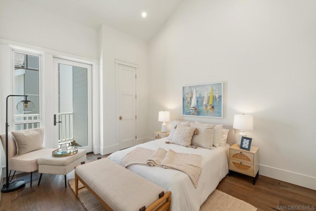 bedroom featuring hardwood / wood-style floors and lofted ceiling