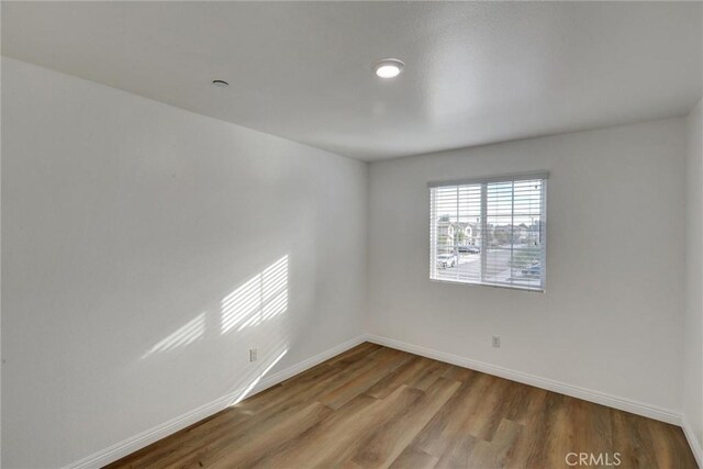 empty room with light hardwood / wood-style floors