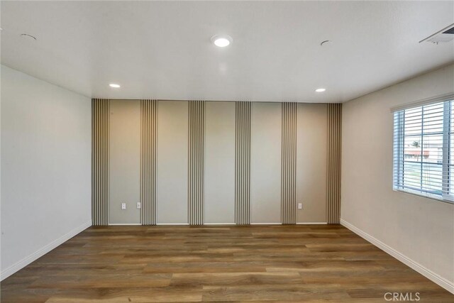 empty room featuring dark hardwood / wood-style floors