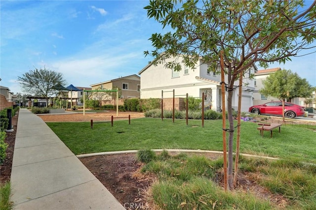 view of home's community with a lawn