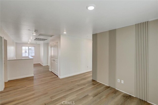 unfurnished room with light hardwood / wood-style flooring