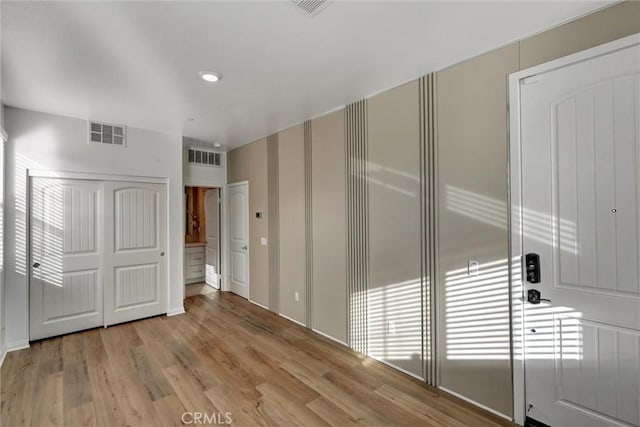 unfurnished bedroom with light hardwood / wood-style floors