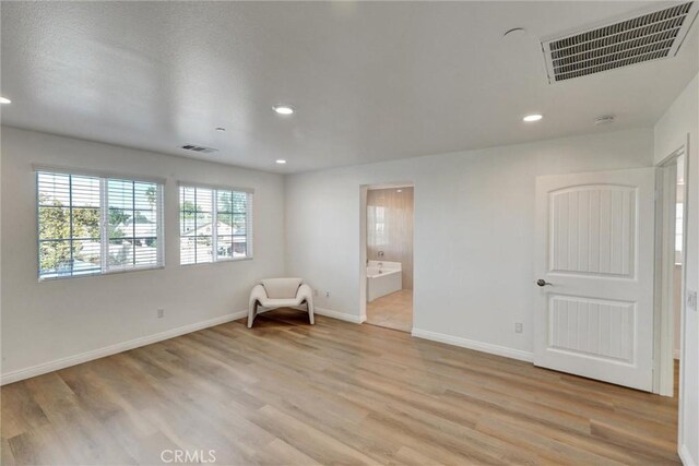 unfurnished room featuring light hardwood / wood-style flooring