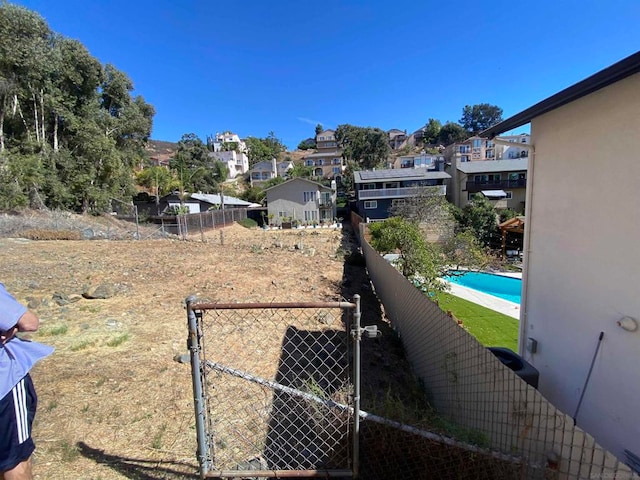 view of yard with a fenced in pool