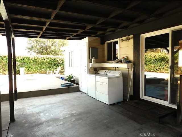 view of patio with independent washer and dryer and exterior kitchen