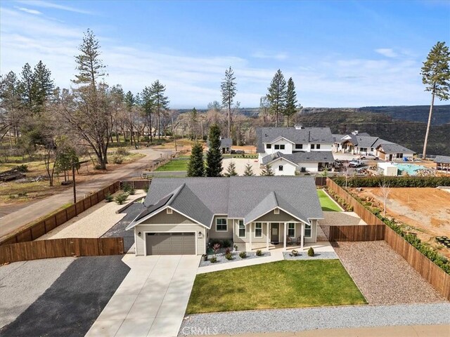 view of front of home featuring a front lawn and a garage