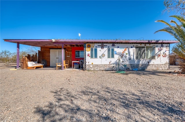 view of front of house with a carport