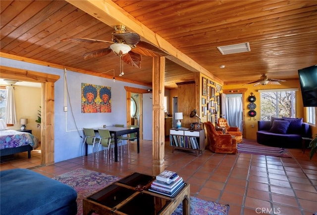 tiled living room with wood ceiling and ceiling fan