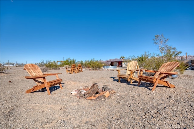 view of yard with an outdoor fire pit