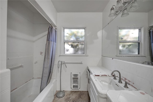 bathroom featuring plenty of natural light, vanity, tile walls, and hardwood / wood-style flooring