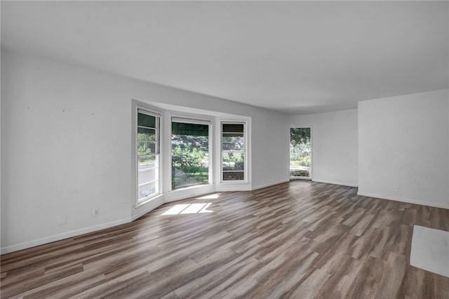 unfurnished room featuring light hardwood / wood-style flooring