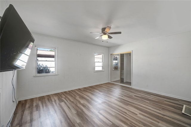 spare room featuring ceiling fan and hardwood / wood-style flooring