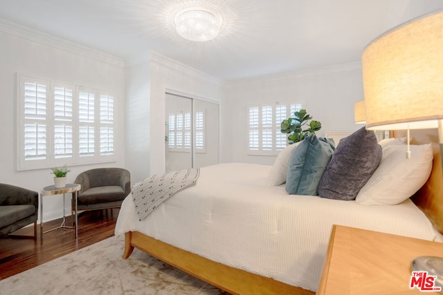 bedroom featuring wood-type flooring and ornamental molding