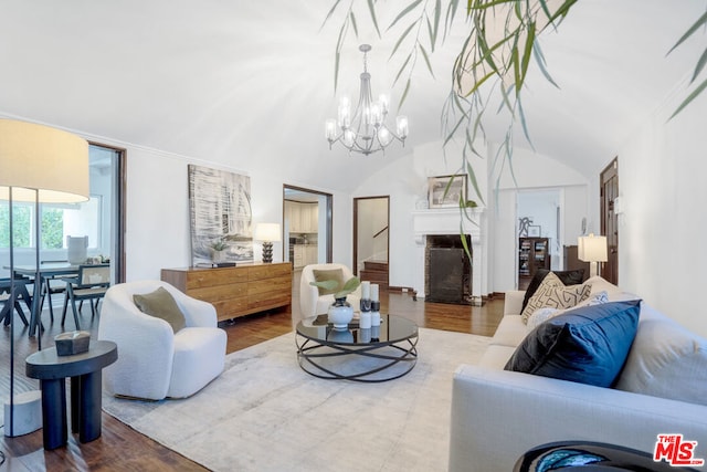 living room with hardwood / wood-style floors and a notable chandelier