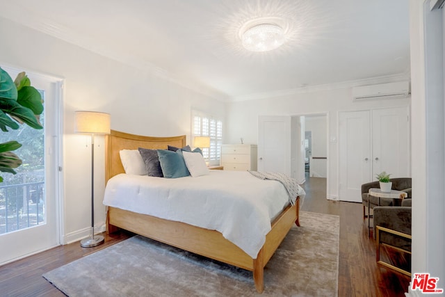 bedroom with ornamental molding, dark wood-type flooring, and a wall unit AC