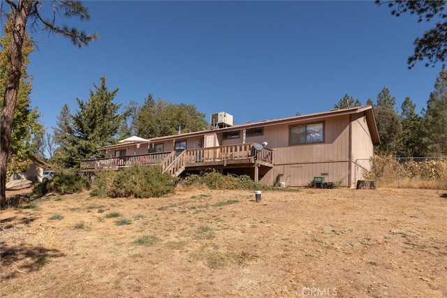 rear view of property featuring a deck