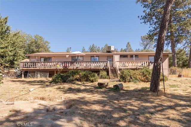 back of house featuring a deck