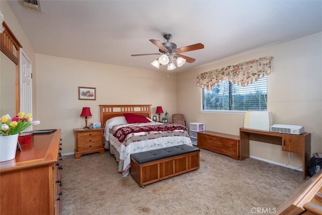 bedroom featuring light carpet and ceiling fan