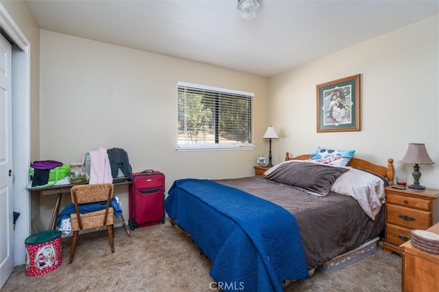 bedroom featuring light colored carpet