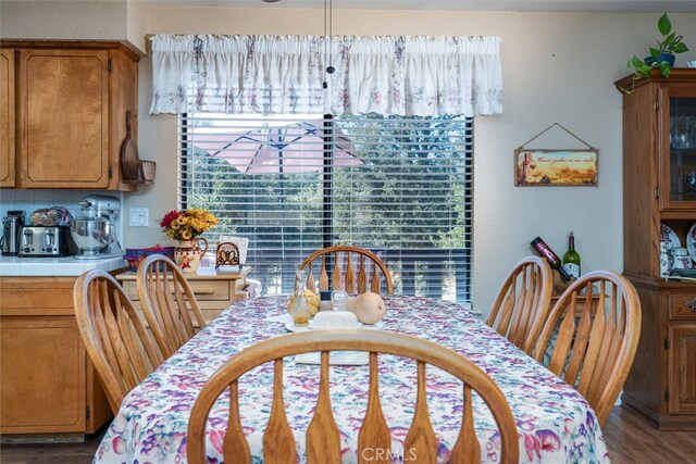 dining space featuring wood-type flooring