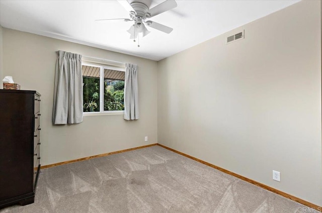 empty room with light carpet and ceiling fan