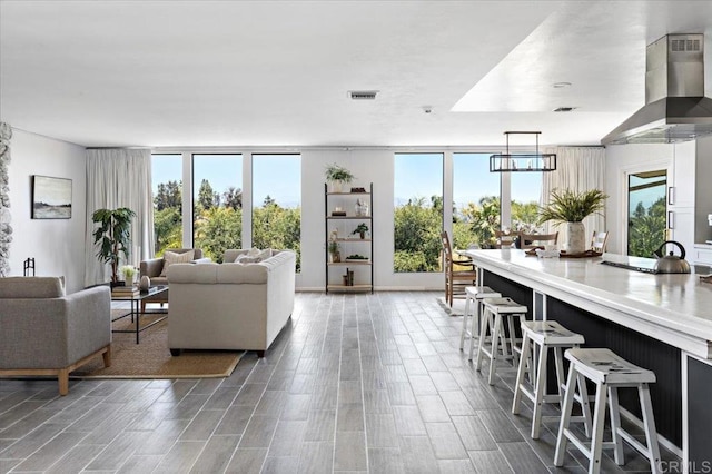 living room with hardwood / wood-style floors and a chandelier