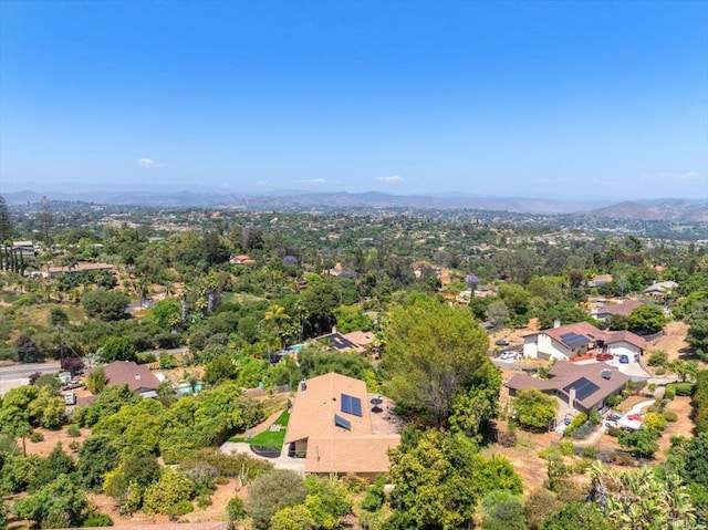 birds eye view of property featuring a mountain view