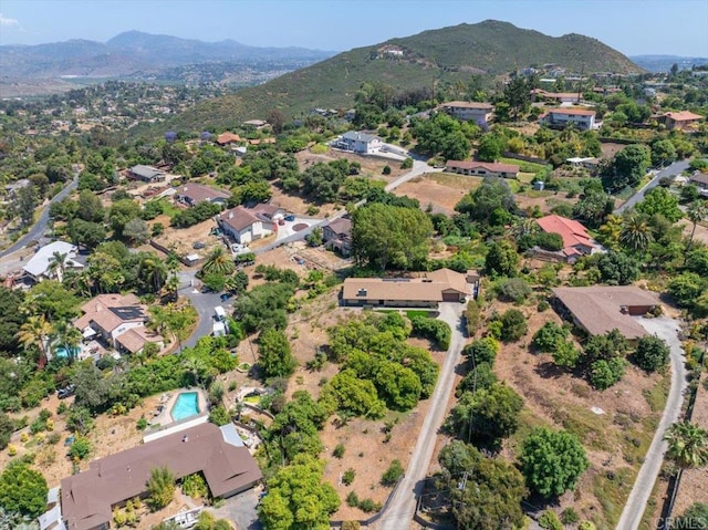 birds eye view of property featuring a mountain view